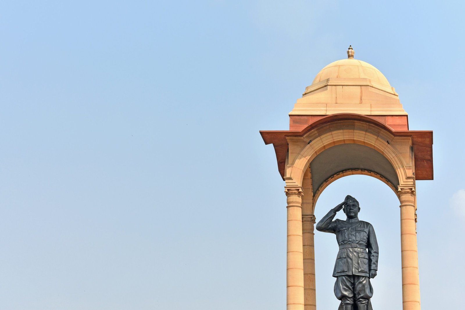 Statue of Netaji Subhas Chandra Bose standing under the historic canopy at India Gate in New Delhi.