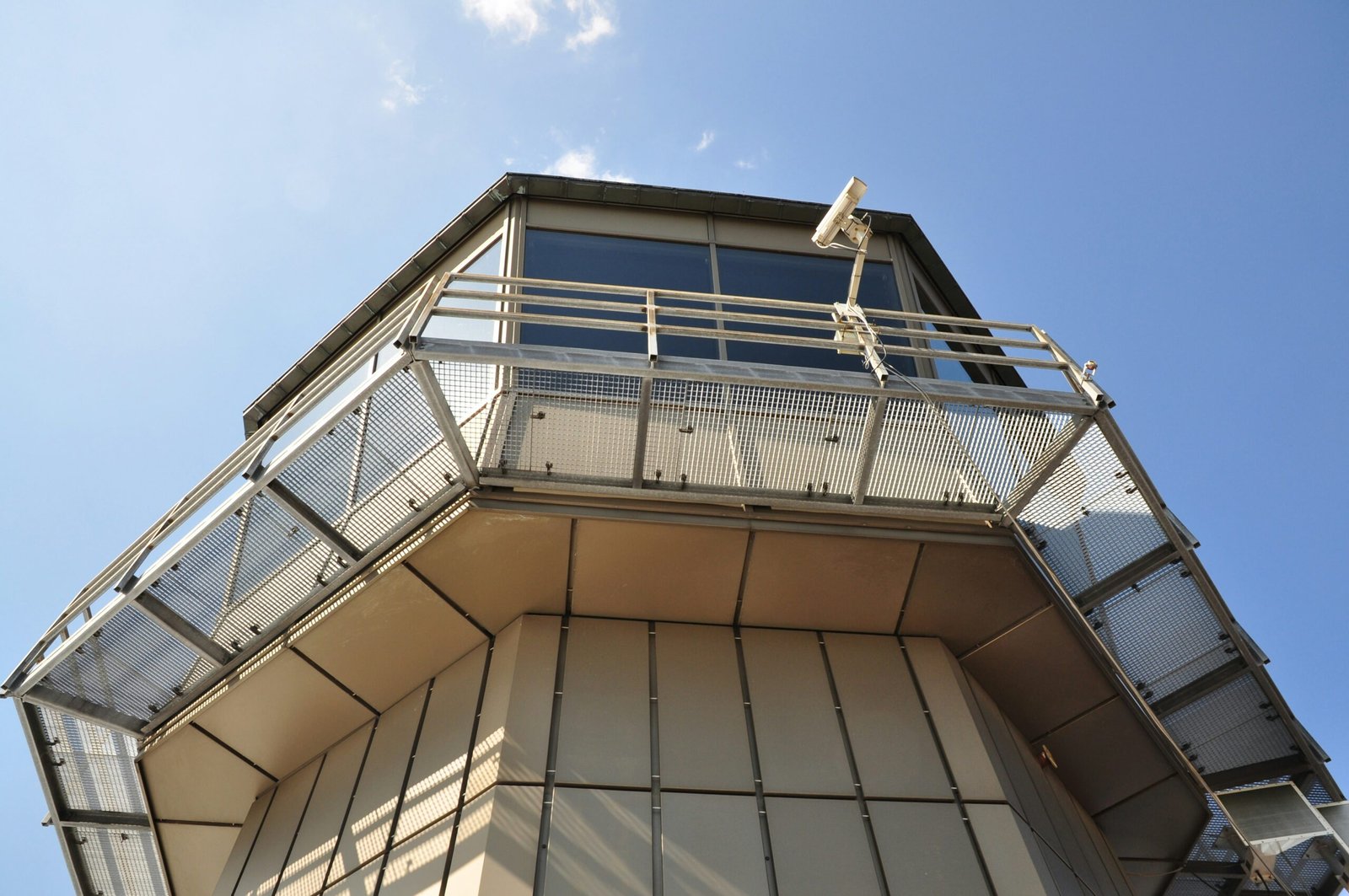 A fortified observation tower with surveillance equipment, symbolizing long-term monitoring, persistence, and strategic cyber espionage operations.